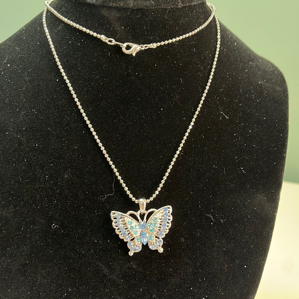 N31. Butterfly necklace with long silver chain.